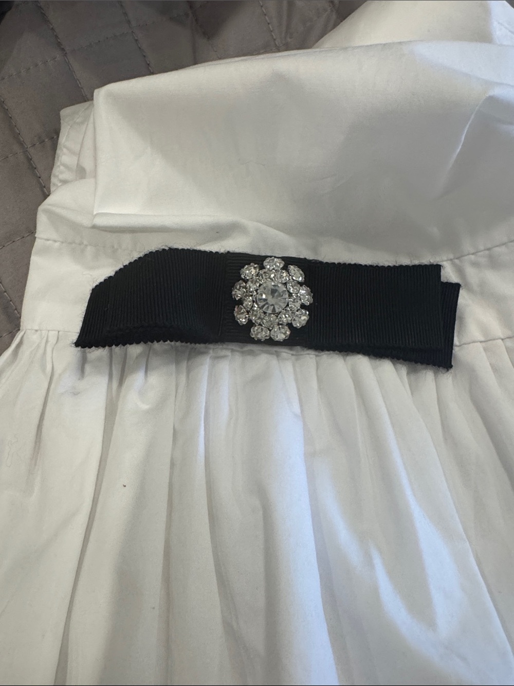 Weill Paris  Puff sleeve cotton blouse w black satin bows on sleeves.
